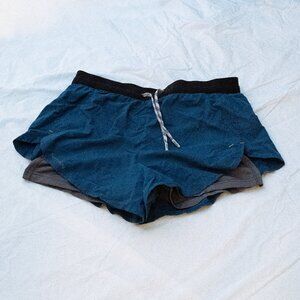 Mid-rise, lightweight, Nathan running shorts with spandex liners with pockets